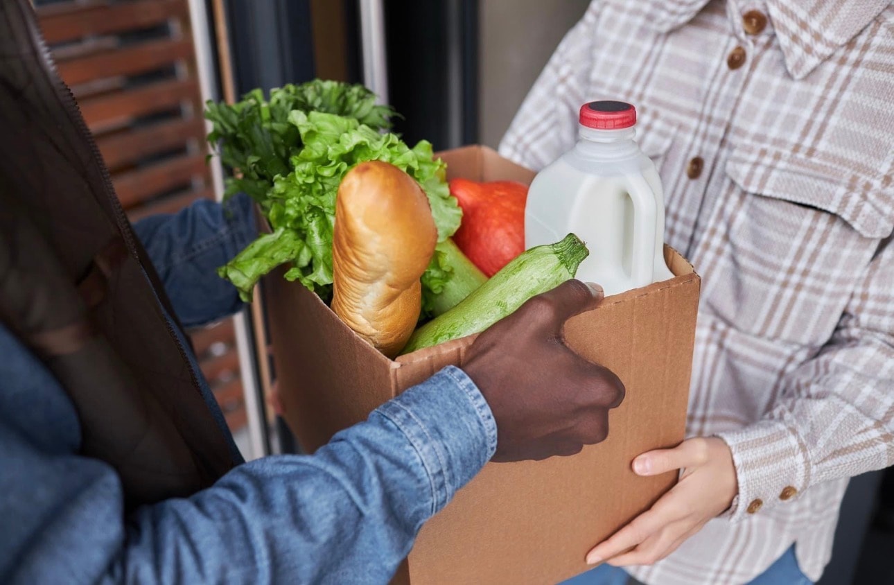 Volunteers serving meals at a community food pantry